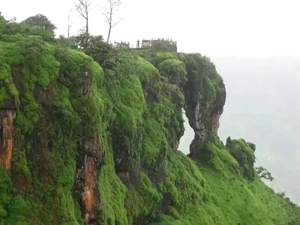 Elephant's Head Point rock formation covered in monsoon greenery, Mahabaleshwar